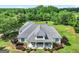 Aerial view of the home showing roof, landscaping, and rocking chair front porch at 377 Parker Rd, Mcdonough, GA 30252
