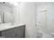 Modern bathroom featuring gray cabinets, quartz countertops, and hexagon tile, creating a clean and stylish look at 377 Parker Rd, Mcdonough, GA 30252