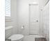 Bathroom featuring white hexagon tile, neutral walls, toilet and white shower curtain to give a clean and modern feel at 377 Parker Rd, Mcdonough, GA 30252