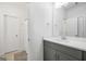 Modern bathroom featuring gray cabinets, quartz countertops, and hexagon tile, creating a clean and stylish look at 377 Parker Rd, Mcdonough, GA 30252
