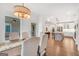 Well-lit dining room with wood floors and view into the open floor plan at 377 Parker Rd, Mcdonough, GA 30252