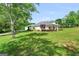 Exterior view of home showing landscaping and long driveway at 377 Parker Rd, Mcdonough, GA 30252