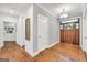 Bright foyer features hardwood floors, elegant lighting, and a view into other rooms, creating a welcoming entry at 377 Parker Rd, Mcdonough, GA 30252