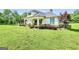 Charming home with a manicured lawn and rocking chair front porch at 377 Parker Rd, Mcdonough, GA 30252