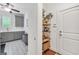 Hallway leading into a laundry room; decoratively appointed with a console table and decor at 377 Parker Rd, Mcdonough, GA 30252