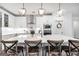 Modern kitchen boasts a large island, white cabinets, stainless steel appliances, and breakfast bar at 377 Parker Rd, Mcdonough, GA 30252