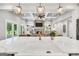 Bright, open kitchen with a marble island, pendant lights and stainless steel appliances at 377 Parker Rd, Mcdonough, GA 30252