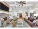 Bright and inviting living room with a brick fireplace and views of the entry and kitchen at 377 Parker Rd, Mcdonough, GA 30252