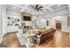 Inviting living room with brick fireplace, built-ins, ceiling fan, and hardwood floors at 377 Parker Rd, Mcdonough, GA 30252