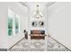 Charming living room showcasing a comfortable leather sofa, stylish rug, and ample natural light, perfect for relaxation at 377 Parker Rd, Mcdonough, GA 30252