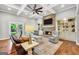 Inviting living room with a cozy fireplace, built-in shelves, and comfortable seating, perfect for relaxing and unwinding at 377 Parker Rd, Mcdonough, GA 30252