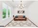 Serene living room filled with natural light, cozy furnishings, and tasteful decor, perfect for comfortable living and relaxation at 377 Parker Rd, Mcdonough, GA 30252