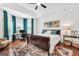 Main bedroom offers hardwood floors, a tray ceiling, and neutral decor at 377 Parker Rd, Mcdonough, GA 30252