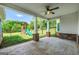 Covered patio with ceiling fan overlooking a backyard with a playset at 377 Parker Rd, Mcdonough, GA 30252