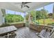 Screened porch features outdoor seating and views of the backyard and playset at 377 Parker Rd, Mcdonough, GA 30252