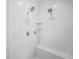 Shower with a bench and dual shower heads in a white tiled enclosure at 377 Parker Rd, Mcdonough, GA 30252