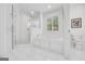 Bathroom featuring a walk-in shower with bench and a soaking tub with window at 377 Parker Rd, Mcdonough, GA 30252