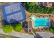 Aerial view of the community pool and tennis courts with mature landscaping and a gazebo at 2990 Haynes Club Cir, Grayson, GA 30017