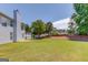 Enjoy outdoor living in this backyard with a large, grassy lawn and mature trees at 2990 Haynes Club Cir, Grayson, GA 30017