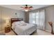 Relax in this comfortable bedroom with a ceiling fan, plush carpet, and a large window at 2990 Haynes Club Cir, Grayson, GA 30017