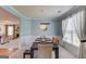 Stylish dining room with modern lighting, wainscoting, and easy access to both the living room and office at 2990 Haynes Club Cir, Grayson, GA 30017