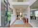 Welcoming entryway with hardwood floors, high ceilings, and an open view into the living and dining areas at 2990 Haynes Club Cir, Grayson, GA 30017