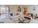 Bright and open living room with a view of the kitchen and a comfortable white sofa at 2990 Haynes Club Cir, Grayson, GA 30017