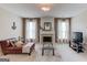 Inviting living room with a fireplace, a comfortable brown leather sofa, and neutral decor at 2990 Haynes Club Cir, Grayson, GA 30017