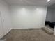 Spacious basement area with neutral carpeting and ample room for customization at 172 Oak Forest Se Dr, Smyrna, GA 30082