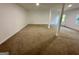 Spacious carpeted basement with white support beams and natural light from a window at 172 Oak Forest Se Dr, Smyrna, GA 30082