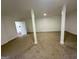 Carpeted basement with white support beams, windows and access to other rooms in home at 172 Oak Forest Se Dr, Smyrna, GA 30082