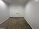 Finished basement space with white trim and carpet, perfect for a home office or play area at 172 Oak Forest Se Dr, Smyrna, GA 30082