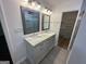 Bright bathroom featuring a double vanity with modern fixtures and a glass-enclosed shower at 172 Oak Forest Se Dr, Smyrna, GA 30082