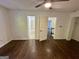 Bedroom with hardwood flooring, ceiling fan, and multiple doorways to other rooms at 172 Oak Forest Se Dr, Smyrna, GA 30082