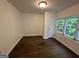 Bedroom featuring hardwood floors, natural light from bay window, and a neutral wall color at 172 Oak Forest Se Dr, Smyrna, GA 30082