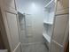White interior closet with shelving and lighting at 172 Oak Forest Se Dr, Smyrna, GA 30082