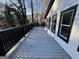 Spacious outdoor deck with black railing and white siding, perfect for entertaining or relaxing at 172 Oak Forest Se Dr, Smyrna, GA 30082