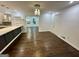 Bright dining room with hardwood floors, contemporary lighting, and a view into an adjacent room at 172 Oak Forest Se Dr, Smyrna, GA 30082