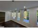 Dining room boasting contemporary pendant lighting and scenic views through multiple windows at 172 Oak Forest Se Dr, Smyrna, GA 30082