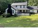 Charming two-story home with black trim and a spacious front yard at 172 Oak Forest Se Dr, Smyrna, GA 30082
