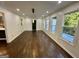 Spacious living room with hardwood floors, large windows and modern lighting at 172 Oak Forest Se Dr, Smyrna, GA 30082