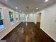 Living room with hardwood floors, recessed lighting, and large windows leading to deck at 172 Oak Forest Se Dr, Smyrna, GA 30082