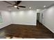 Open living room features hardwood floors, a ceiling fan, and an open entry at 172 Oak Forest Se Dr, Smyrna, GA 30082