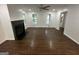 Living room showcasing hardwood floors, a fireplace, and an entry to another room at 172 Oak Forest Se Dr, Smyrna, GA 30082