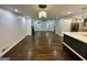 Open living space with hardwood floors, fireplace, and connection to the kitchen at 172 Oak Forest Se Dr, Smyrna, GA 30082