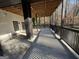 A covered porch featuring a cement floor and views of the woods at 172 Oak Forest Se Dr, Smyrna, GA 30082