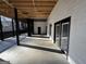 A covered deck featuring a cement floor and many doors at 172 Oak Forest Se Dr, Smyrna, GA 30082