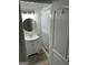 Updated bathroom with a modern vanity, mirror, and window, offering a clean and bright space at 113 Ausband Dr, Mcdonough, GA 30253