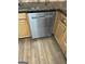 Stainless steel Whirlpool dishwasher with wood cabinets and granite countertop at 113 Ausband Dr, Mcdonough, GA 30253