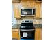 Close-up of a kitchen with stainless steel appliances and granite countertops at 113 Ausband Dr, Mcdonough, GA 30253